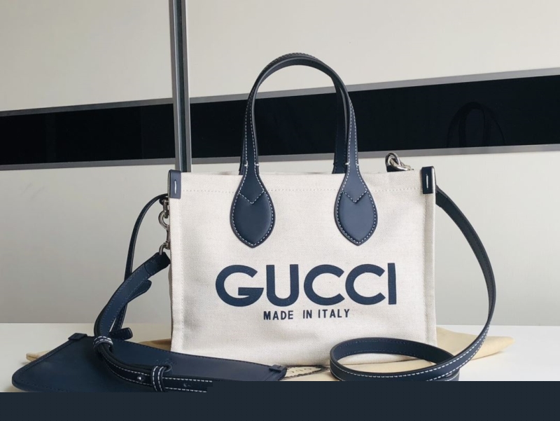 G*u*i shopping bags